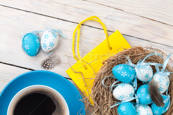 Easter background with blue and white eggs in nest, yellow tulip Stock photo © karandaev