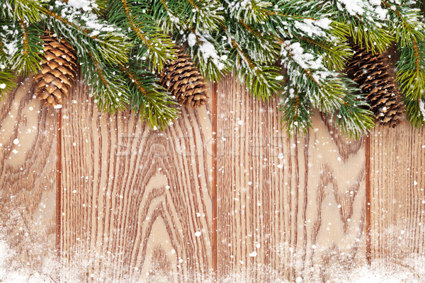 Christmas wooden background with snow fir tree Stock photo © karandaev