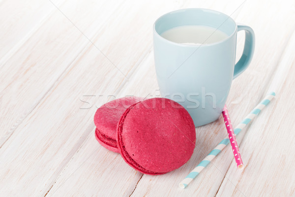 Colorful macarons and cup of milk Stock photo © karandaev