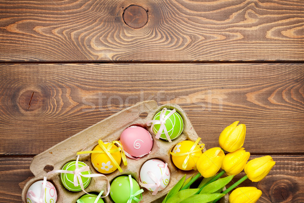 Stock photo: Easter background with colorful eggs and yellow tulips