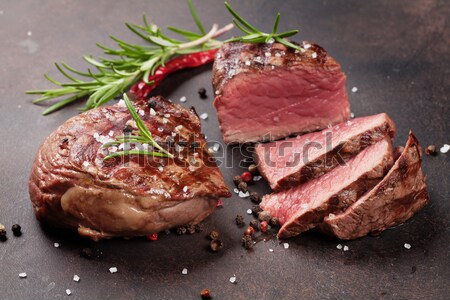 Grilled beef steak with rosemary, salt and pepper Stock photo © karandaev