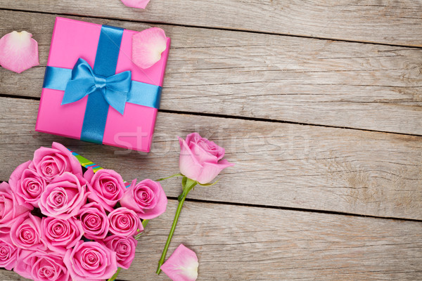 Valentines day background with gift box full of pink roses Stock photo © karandaev