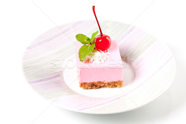Pink cheesecake with maraschino cherry and mint Stock photo © karandaev