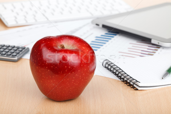 Ripe red apple on workplace Stock photo © karandaev