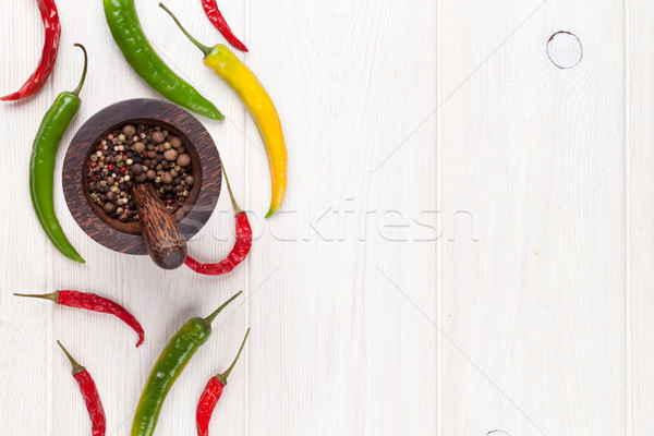 Colorato peperoncino granello di pepe bianco tavolo in legno top Foto d'archivio © karandaev