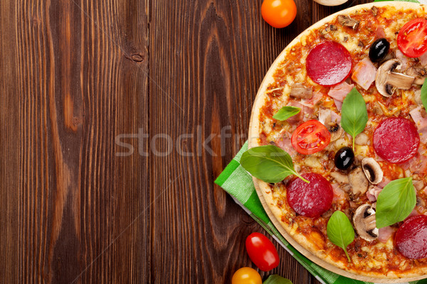 İtalyan pizza pepperoni domates zeytin fesleğen Stok fotoğraf © karandaev