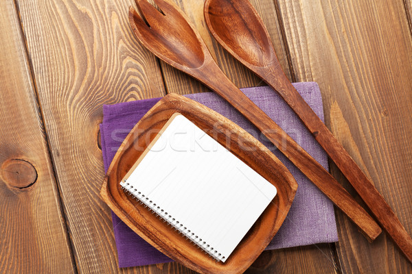 Wood kitchen utensils over wooden table background Stock photo © karandaev