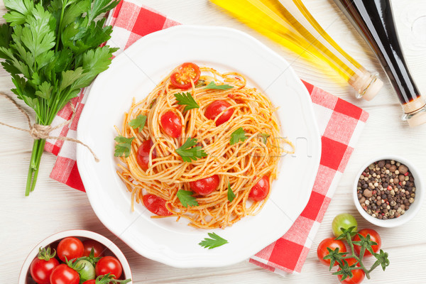 Spaghettis pâtes tomates persil table en bois haut [[stock_photo]] © karandaev