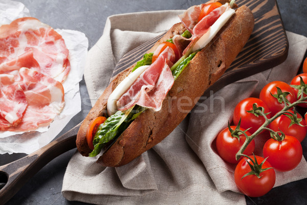 Sandwich with salad, prosciutto and mozzarella Stock photo © karandaev