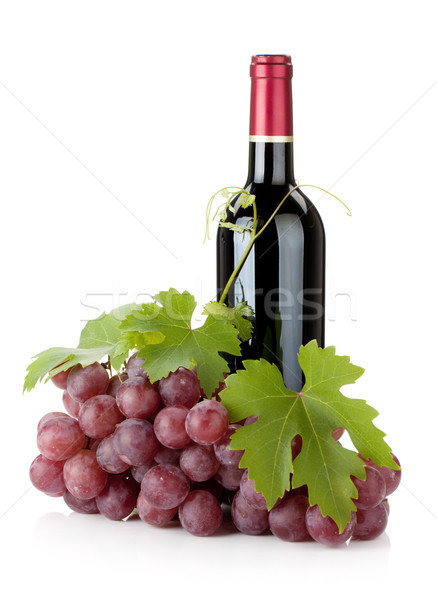 Red wine bottle and grapes Stock photo © karandaev
