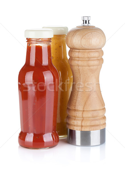 Stock photo: Mustard and ketchup glass bottles with pepper shaker