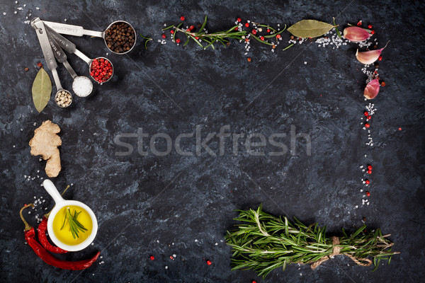 Herbs and spices over black stone Stock photo © karandaev
