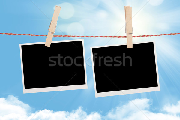 Blank photos hanging on clothesline Stock photo © karandaev