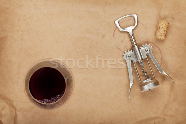 Stock photo: Wine glass, cork and corkscrew with red wine stains