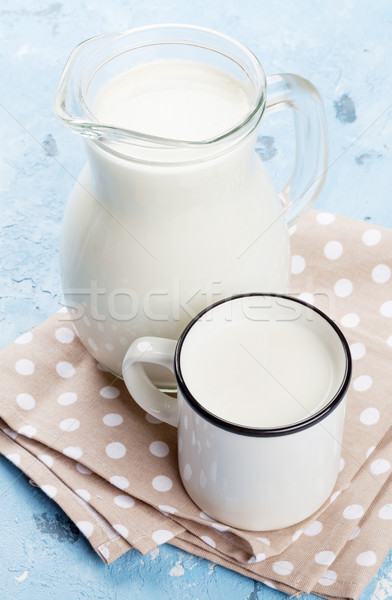 Milk jug and cup Stock photo © karandaev