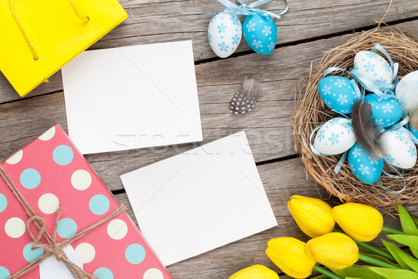 Easter background with blank photo frames, blue and white eggs,  Stock photo © karandaev
