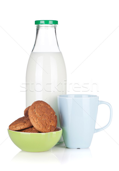 Cup, bottle of milk and bowl with cookies Stock photo © karandaev