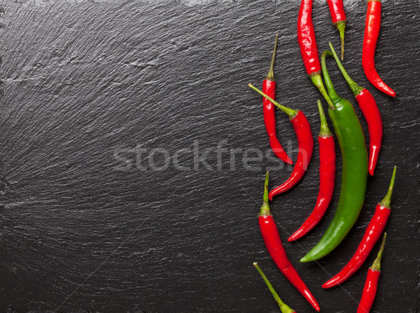 Chilipaprika fekete kő asztal copy space űr Stock fotó © karandaev