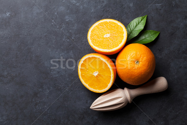 Oranges and juicer Stock photo © karandaev