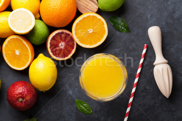 Fresh ripe citruses and juice. Lemons, limes and oranges Stock photo © karandaev