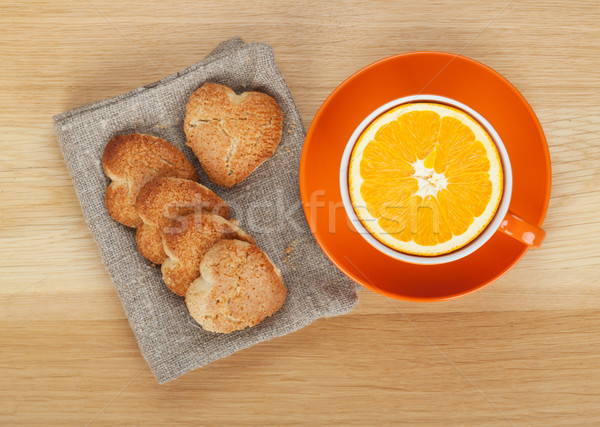 Cup with orange and cookies Stock photo © karandaev