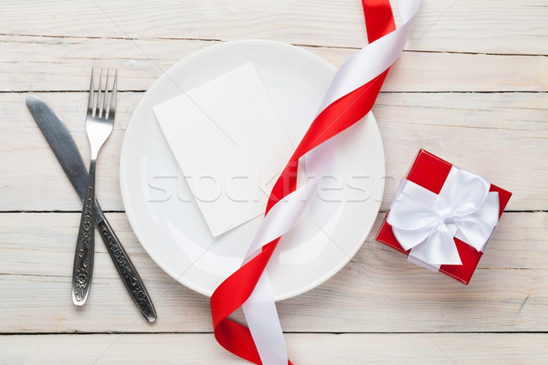 Valentines day greeting card over plate and gift box Stock photo © karandaev