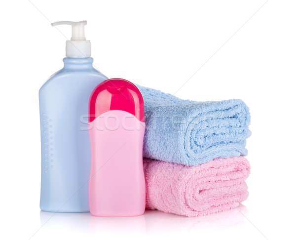 Shampoo and gel bottles with towels Stock photo © karandaev