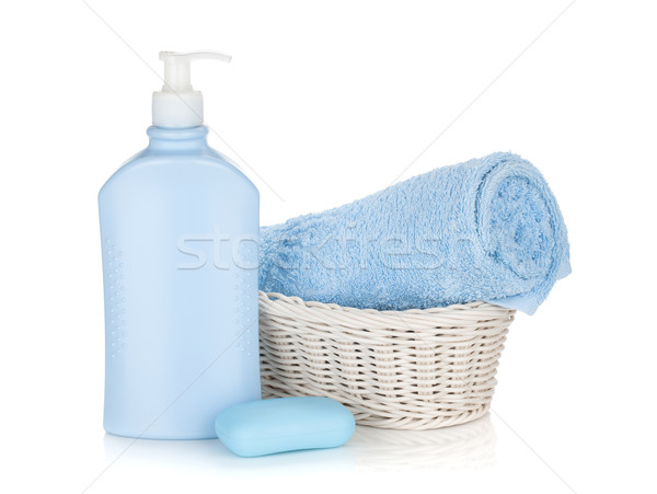 Shampoo bottle, soap and blue towel Stock photo © karandaev