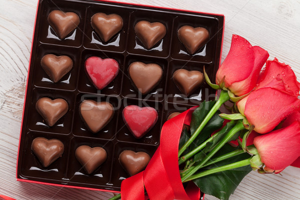 Valentines day with red roses and chocolate Stock photo © karandaev