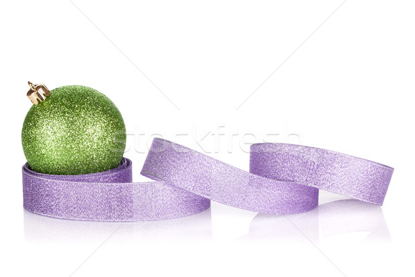 Green sparkling christmas bauble with purple ribbon Stock photo © karandaev