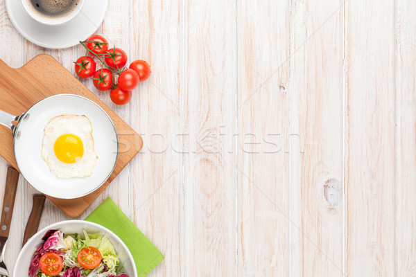 Healthy breakfast with fried egg, tomatoes and salad Stock photo © karandaev