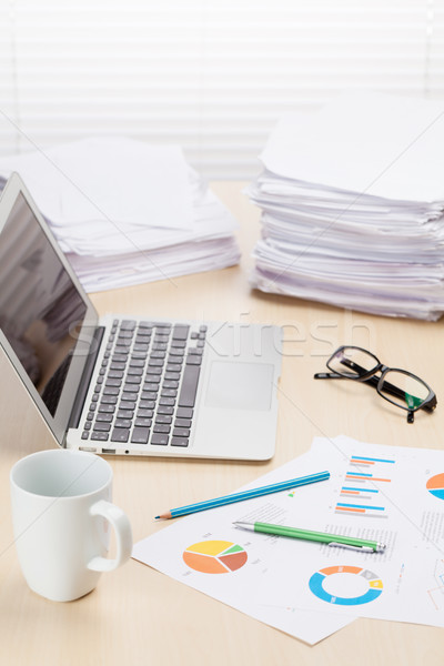 Office workplace with coffee cup, laptop and supplies Stock photo © karandaev