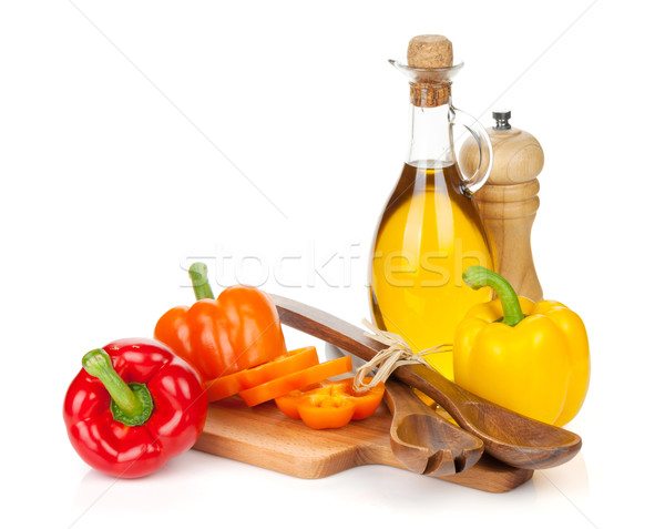 Stock photo: Colorful bell peppers and kitchen utensils