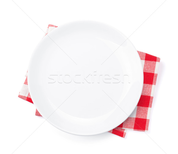 Empty plate over kitchen towel Stock photo © karandaev