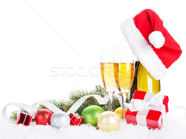 Champagne, christmas decor and santa hat Stock photo © karandaev