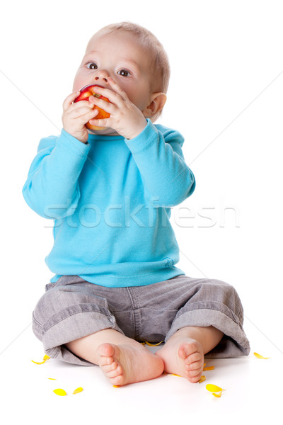 Stock photo: Small baby eating red apple