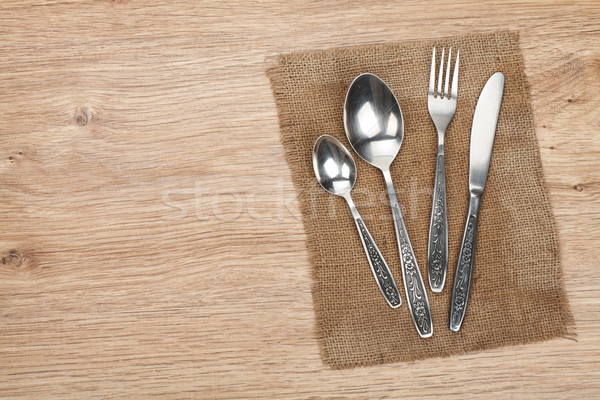Ezüst étkészlet szett villa kanál kés fa asztal Stock fotó © karandaev