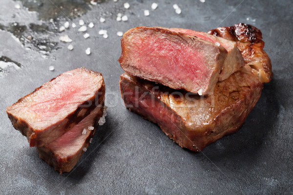 Gegrillt geschnitten Beefsteak Salz Pfeffer Stein Stock foto © karandaev
