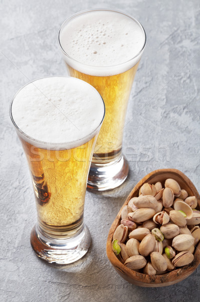 Piwo jasne pełne piwa orzechy okulary kamień Zdjęcia stock © karandaev