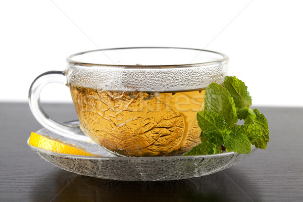 Copo chá verde limão de escuro mesa de madeira Foto stock © karandaev
