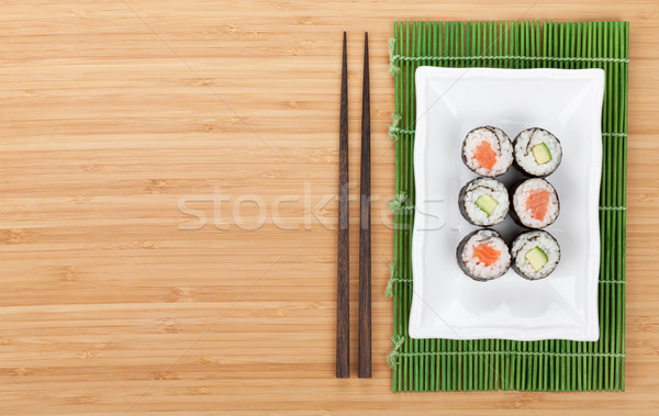 Sushis saumon concombre bambou table [[stock_photo]] © karandaev