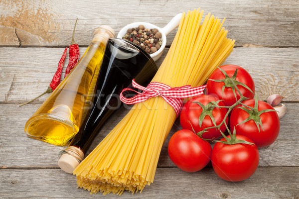Pasta, tomatoes, condiments and spices Stock photo © karandaev