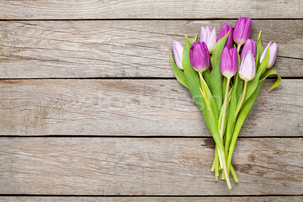 Stock photo: Purple tulips over wooden table