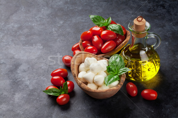 Mozzarella cheese, tomatoes and basil Stock photo © karandaev