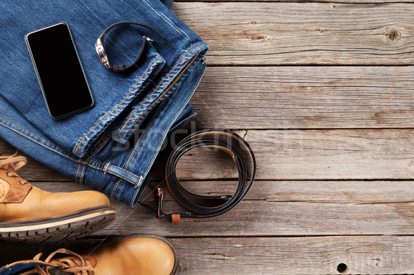 Vestiti accessori jeans scarpe cintura smartphone Foto d'archivio © karandaev