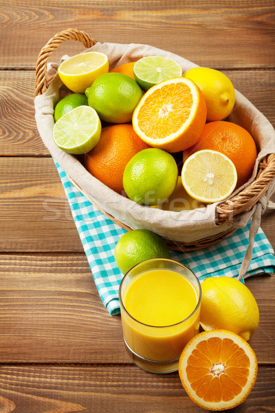 Stock photo: Citrus fruits and glass of juice