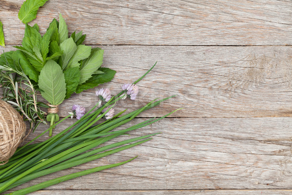 Fresh herbs on garden table Stock photo © karandaev