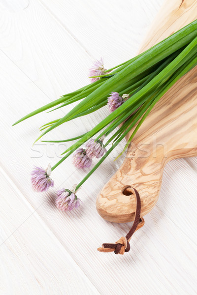 Stock photo: Fresh spring onion on cutting board