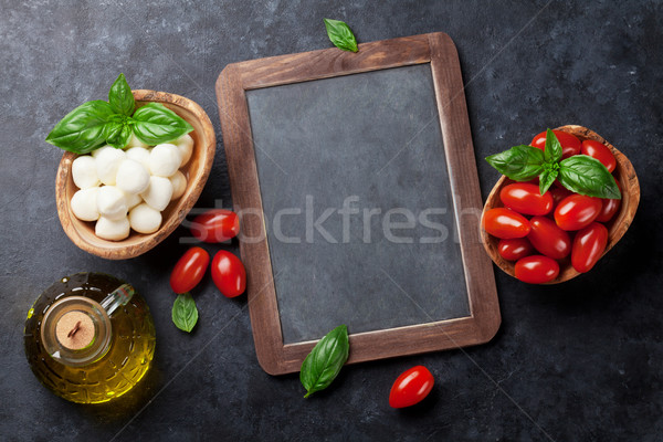 Mozzarella cheese, tomatoes and basil Stock photo © karandaev