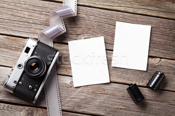 Vintage camera and blank photo frames Stock photo © karandaev